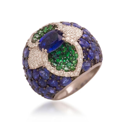 Luxury cocktail ring set with Kyanite, Sapphire and Tsavorite on a white background