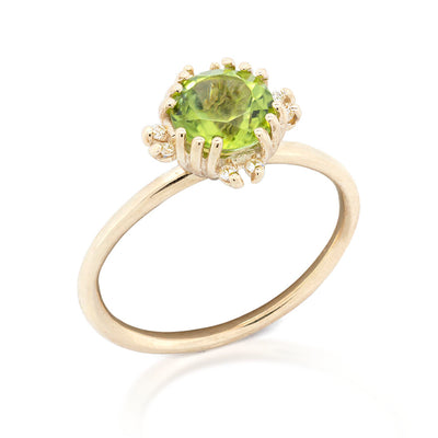 Solstice Radiance Ring with Peridot & Diamonds on a white background